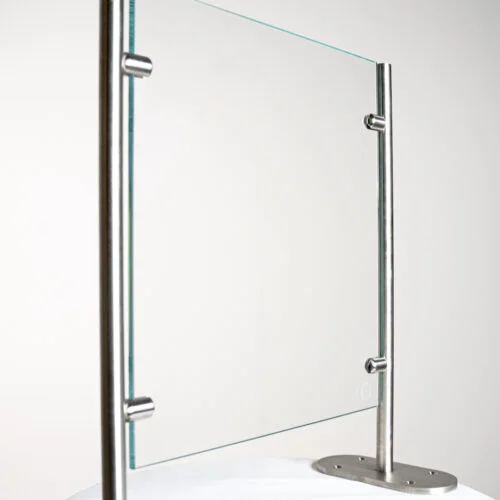 Clear glass protective barrier with stainless steel posts.